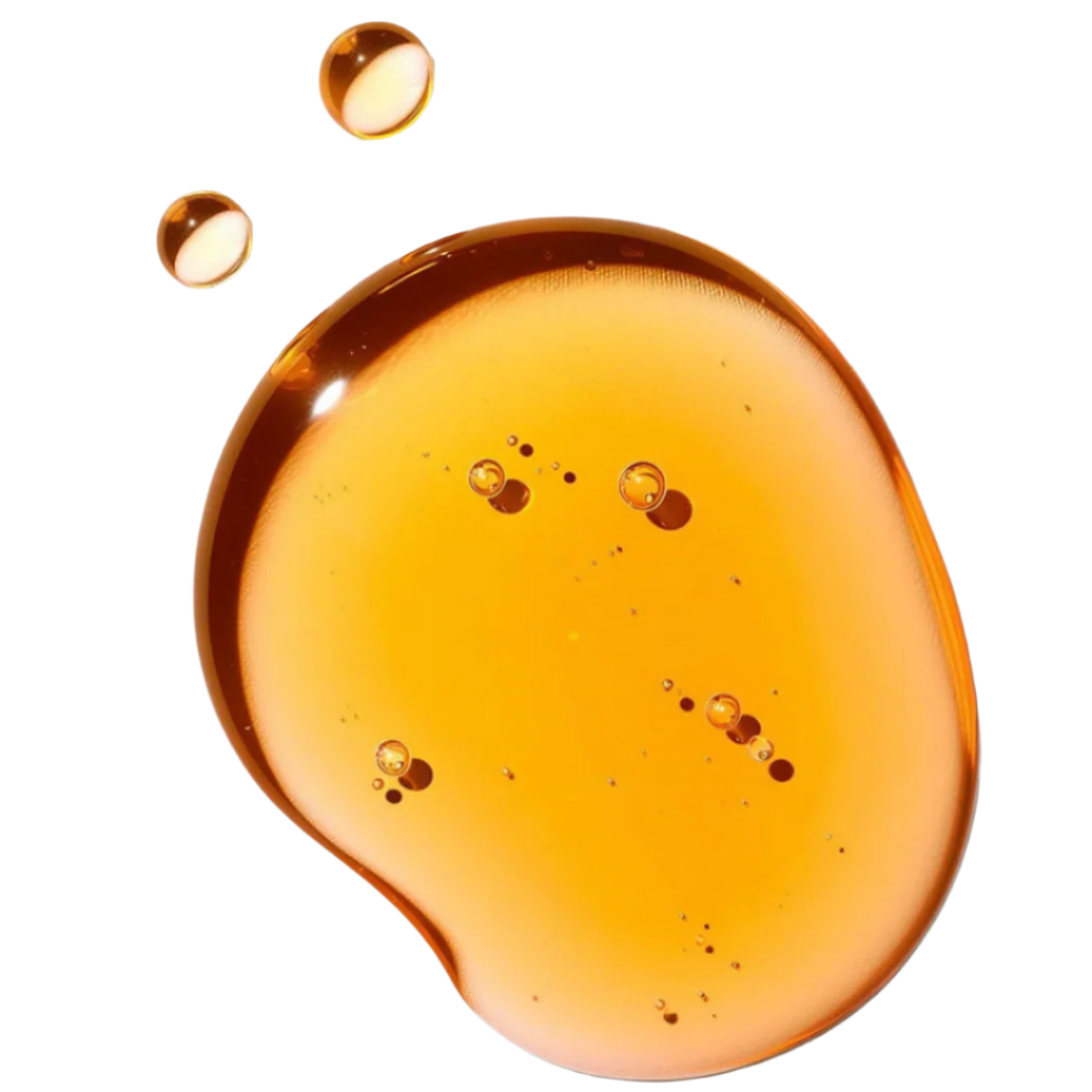 Close-up of amber-colored ABQ Face Oil with droplets on a white background