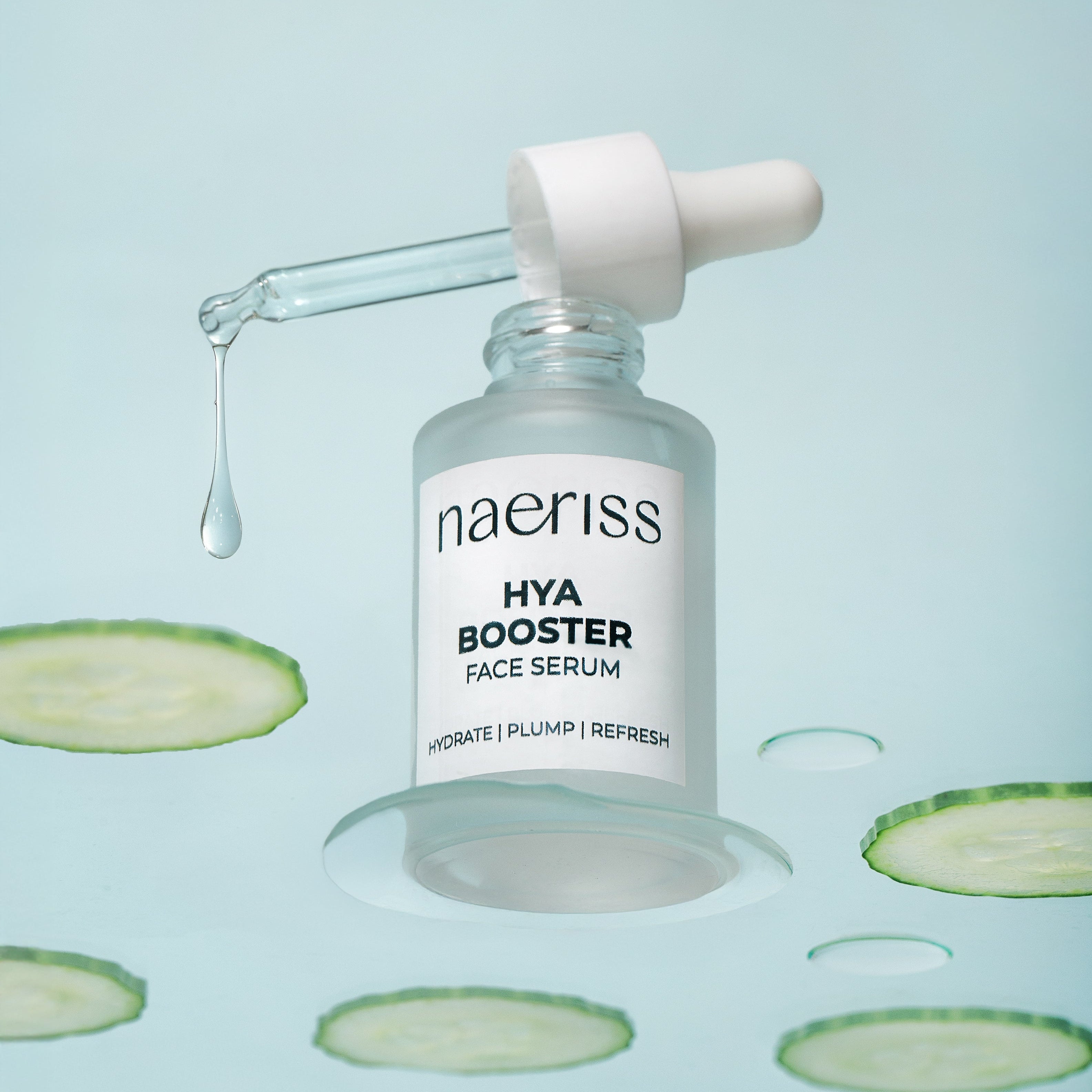 naeriss Hya Booster Face Serum bottle with dropper on a light blue background with cucumber slices.