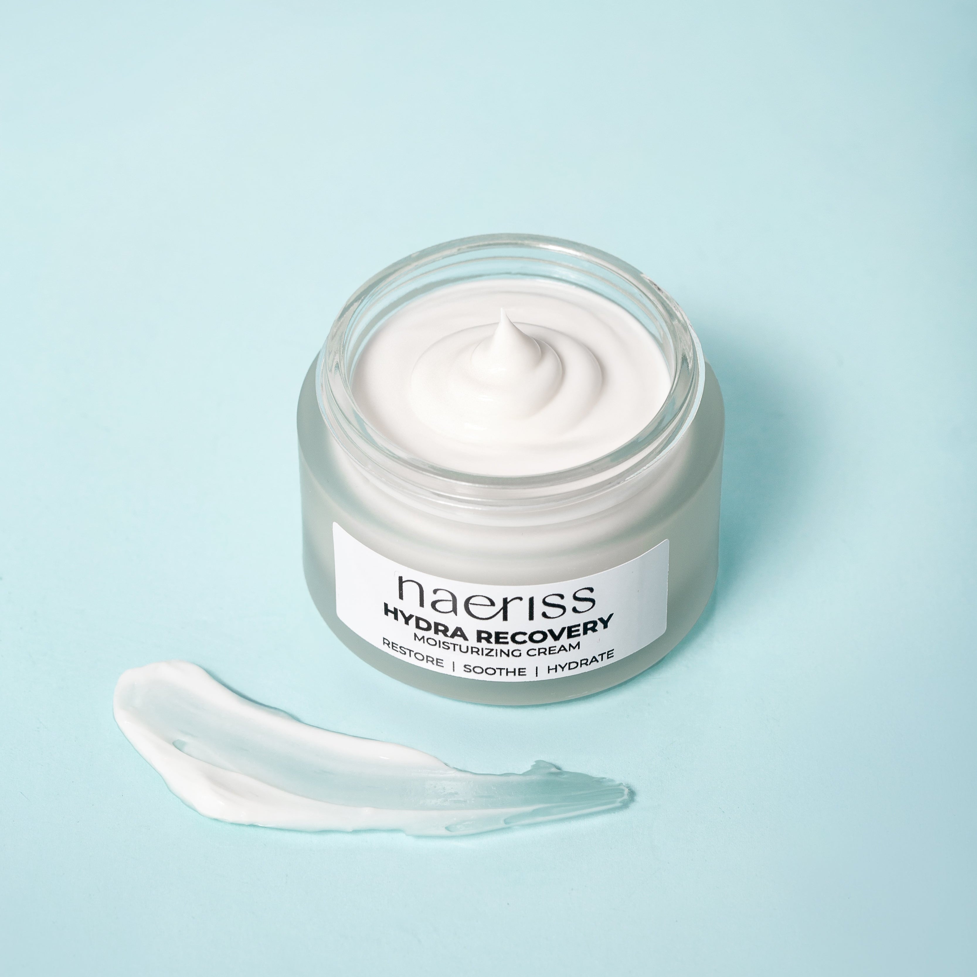 Jar of naeriss Hydra Recovery Moisturizing Cream on a light blue background