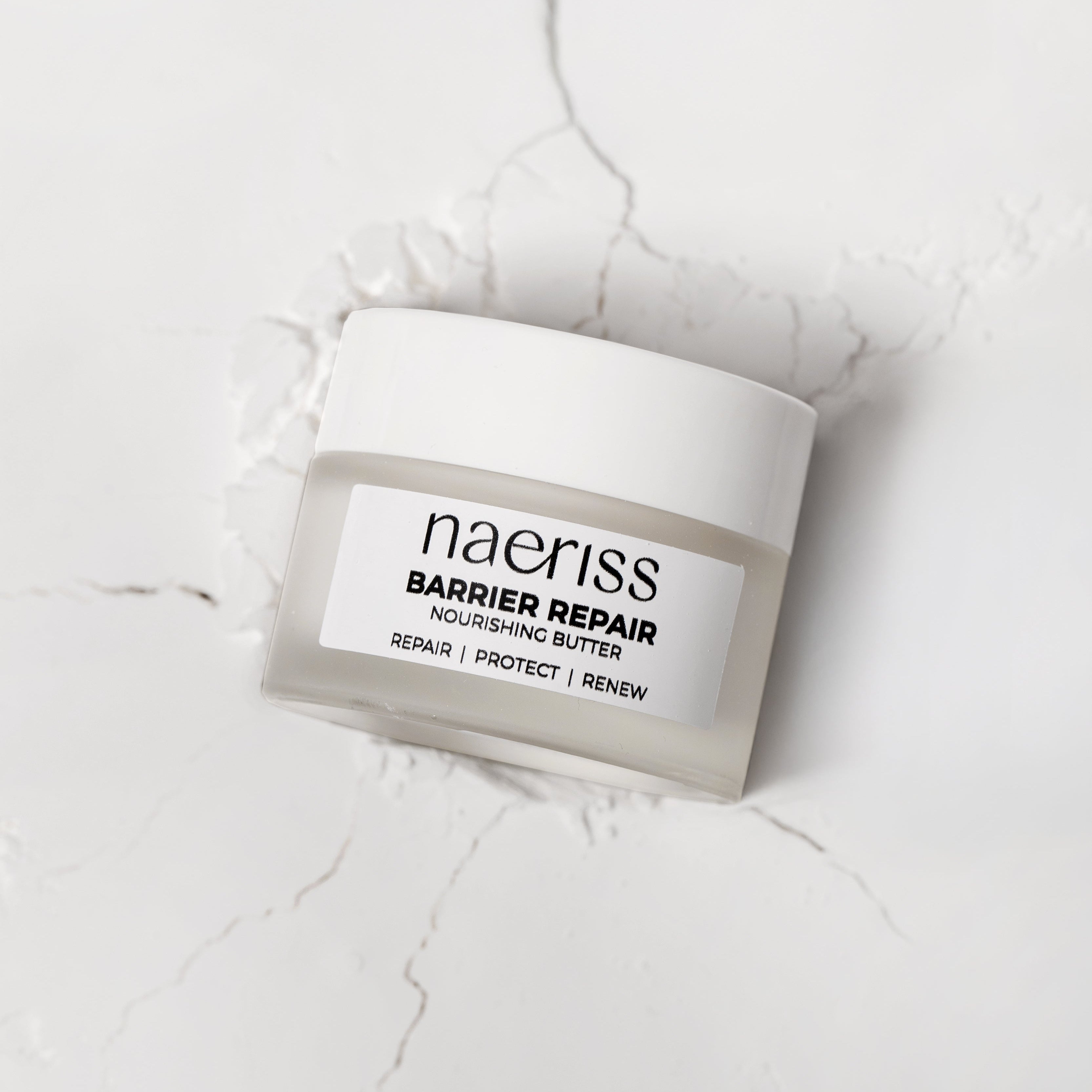 Naeriss Barrier Repair product on a white marble surface
