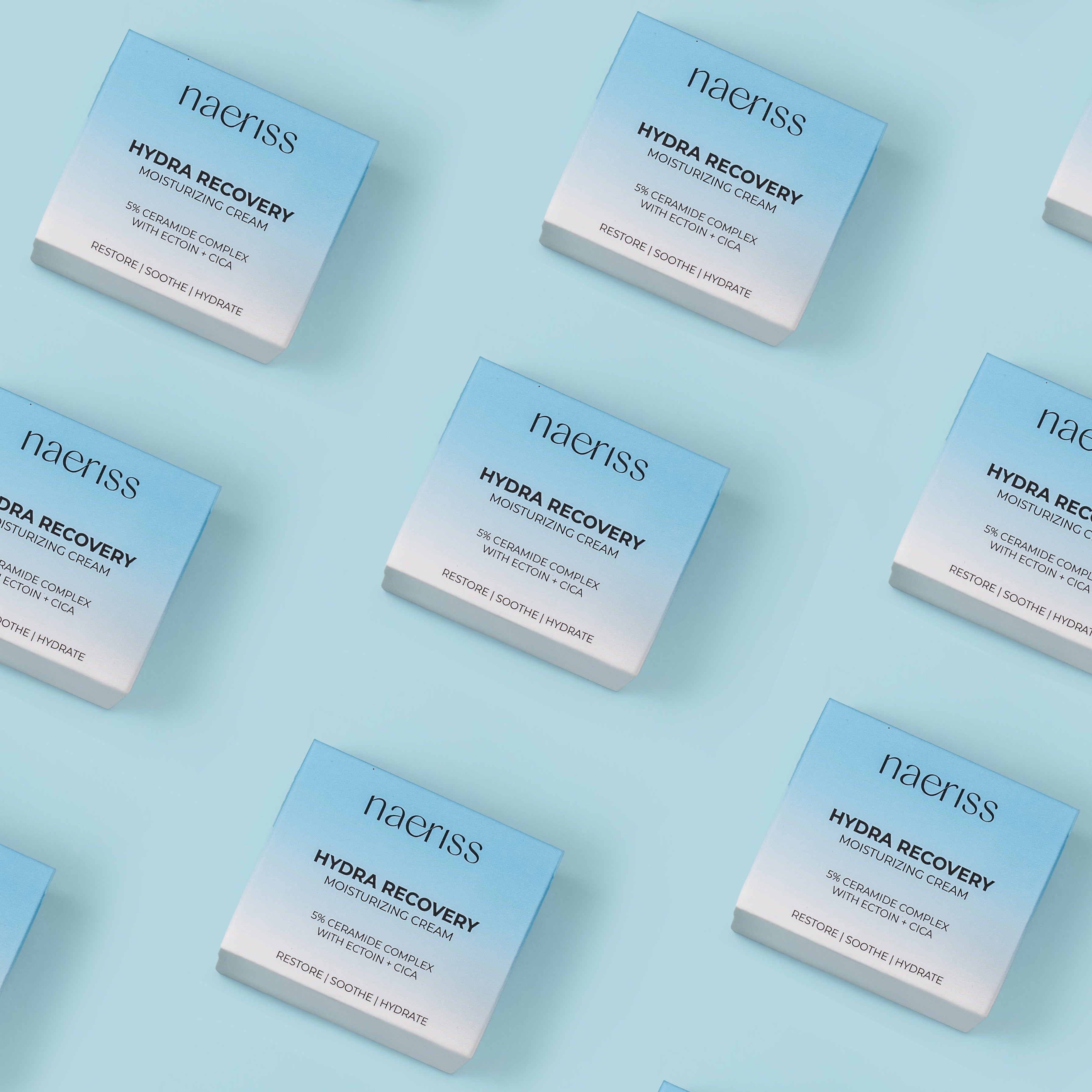 Multiple boxes of naeriss Hydra Recovery skincare product on a light blue background