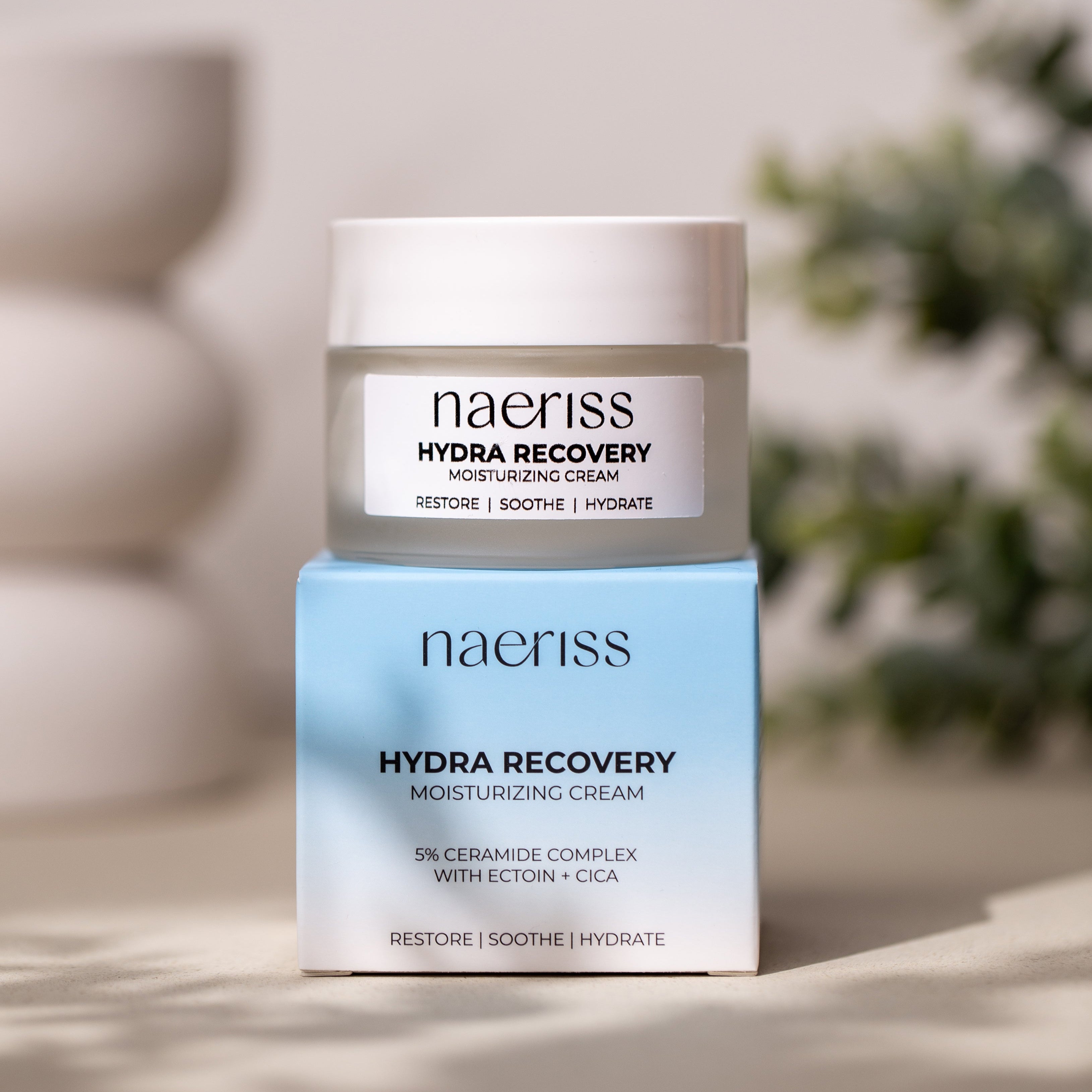 Naeriss Hydra Recovery moisturizing cream jar and box on a neutral background