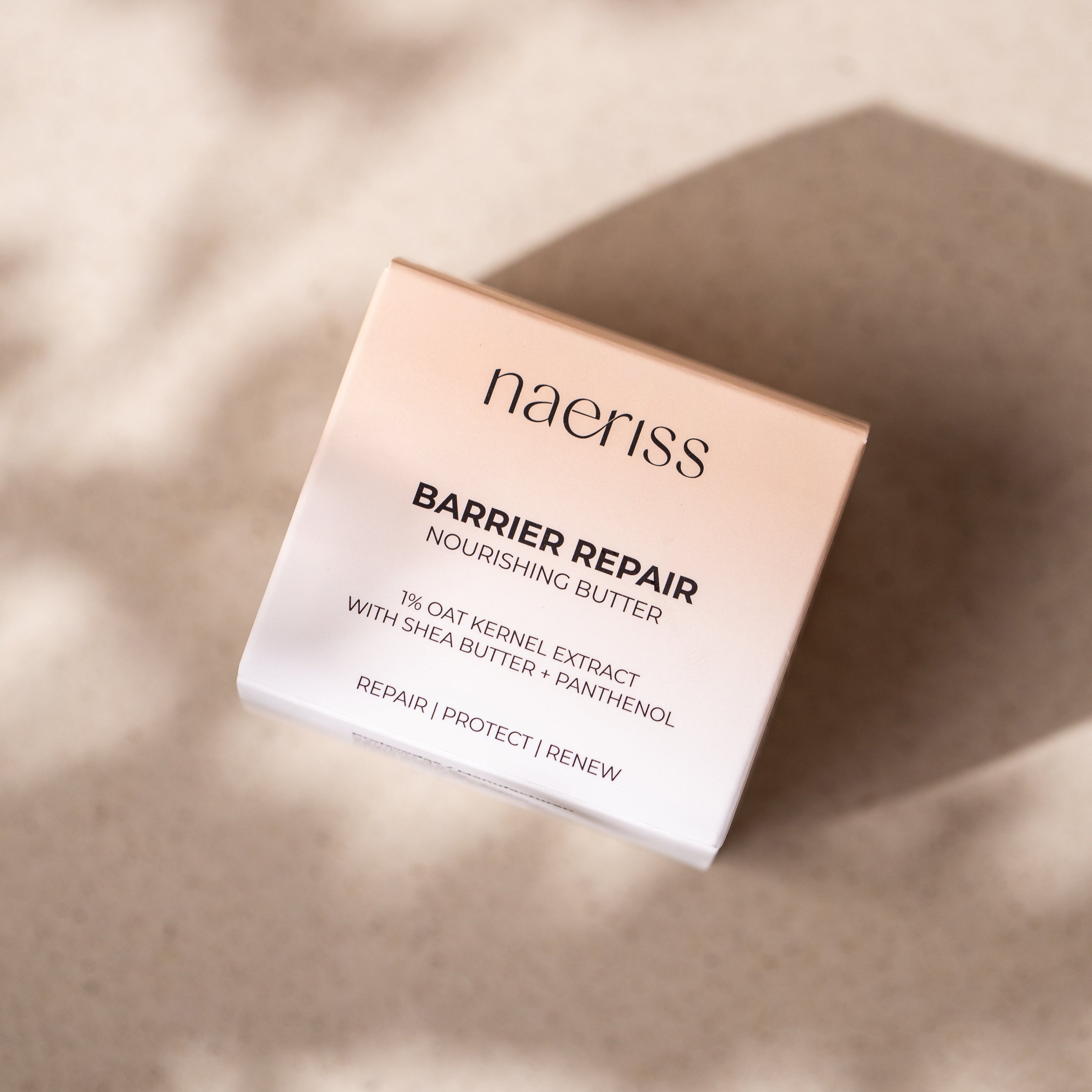 Naeriss Barrier Repair Nourishing Butter packaging on a beige background